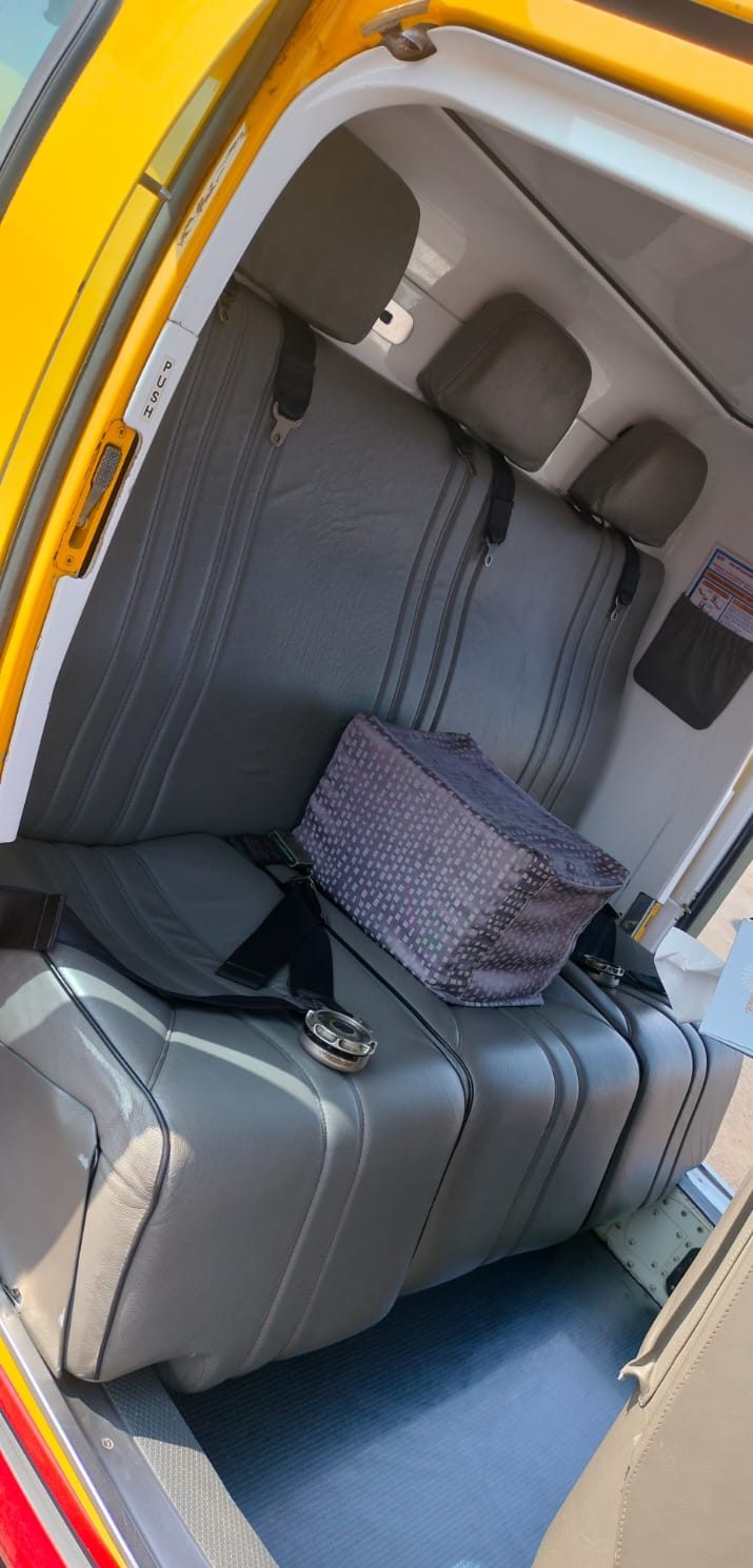 Grey leather bench seat in the AW109SP cabin
